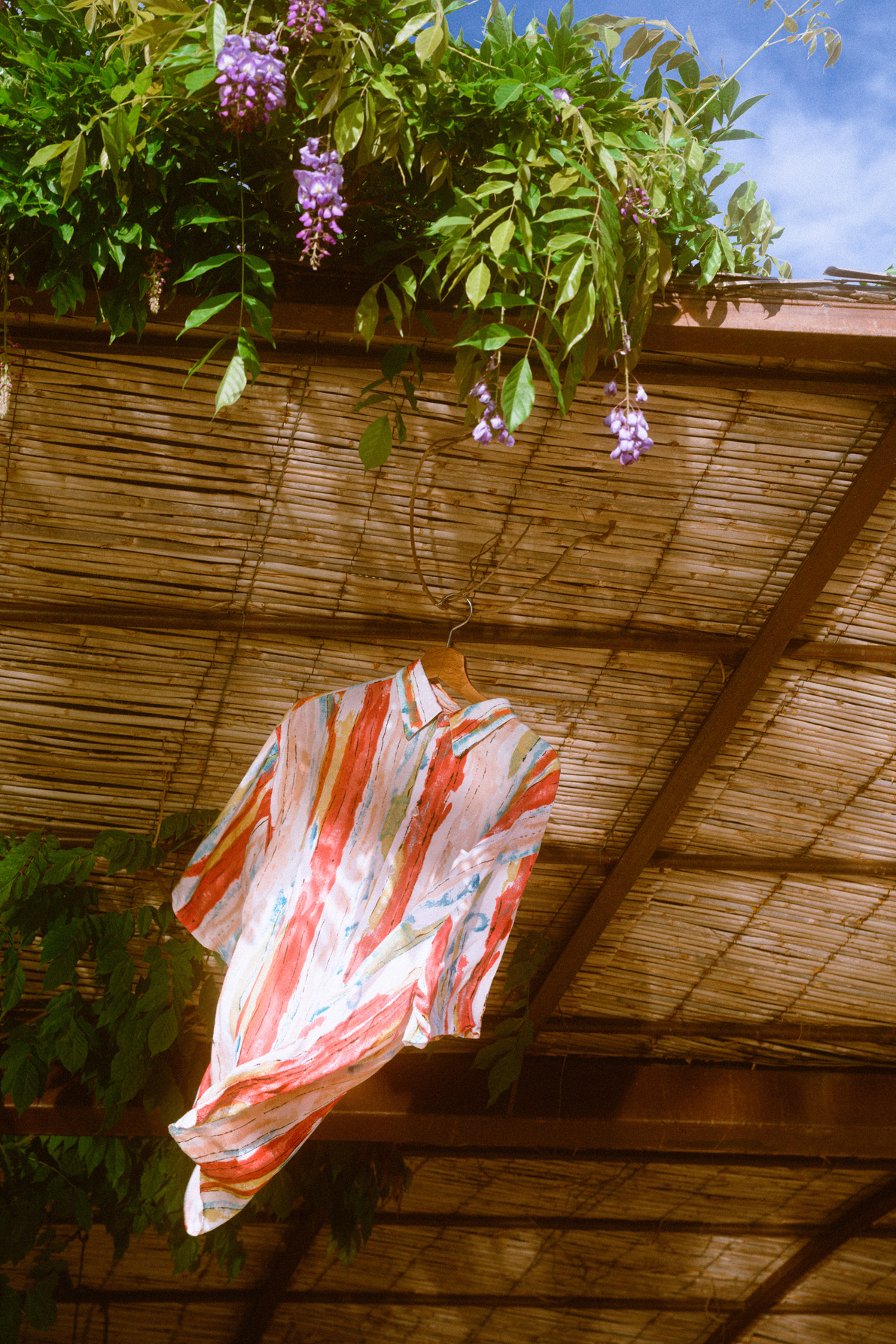 Summer Dress Shirt Hanging on Hut Outdoors